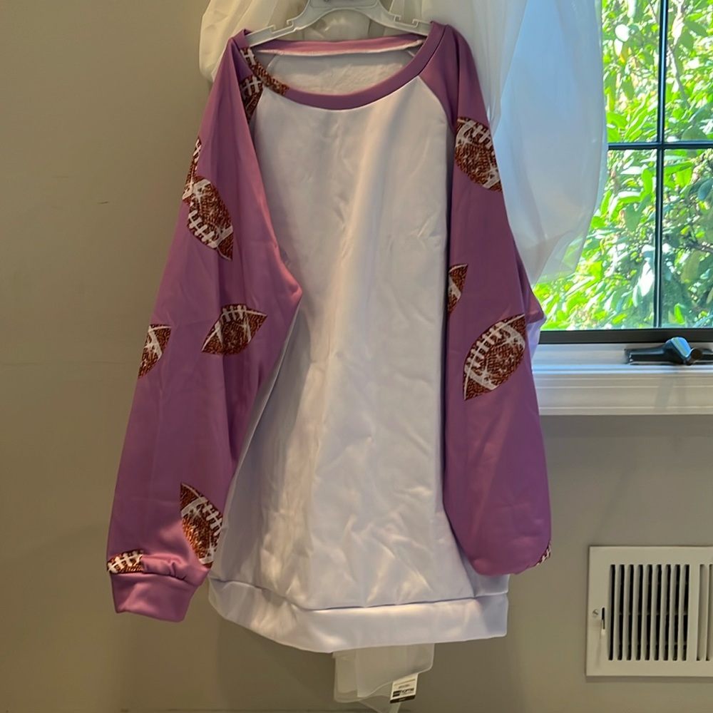 Women’s Pink and white football sleeve pattern sweat shirt size XL Never worn